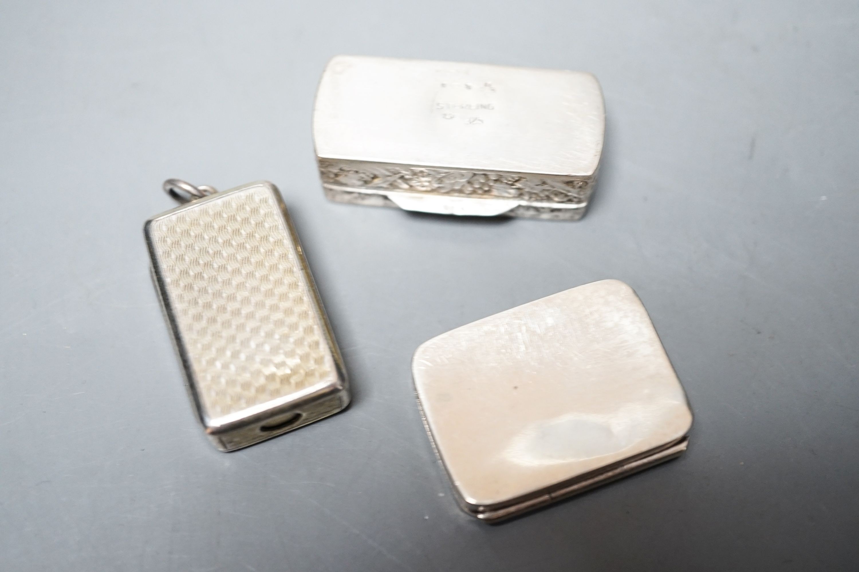 A Victorian silver gilt combination snuff box/ cigar cutter? London, 1855, 32mm and two later boxes.